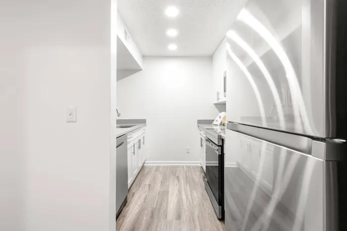 White galley kitchen in an apartment complex in Clearwater, FL.