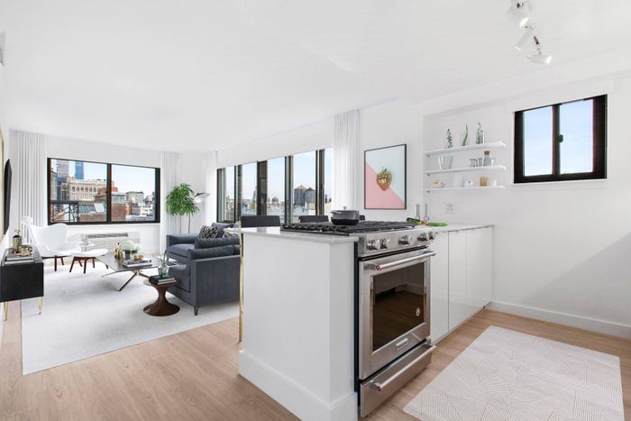 Stainless steel appliances and white cabinets