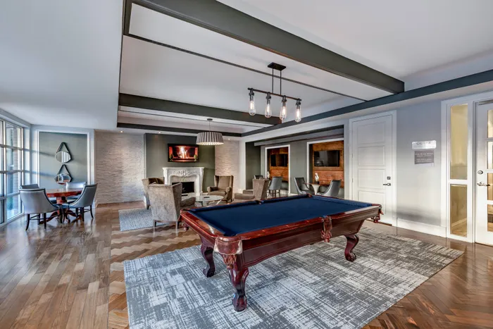 Resident Clubroom with Billiards, Lounge Area, Fireplace, and Flat Screen TVs