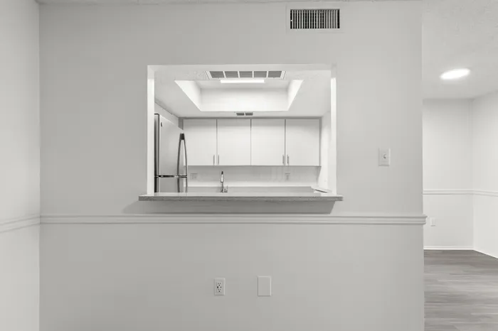 Kitchen with white cabinetry in an apartment in Clearwater, FL.