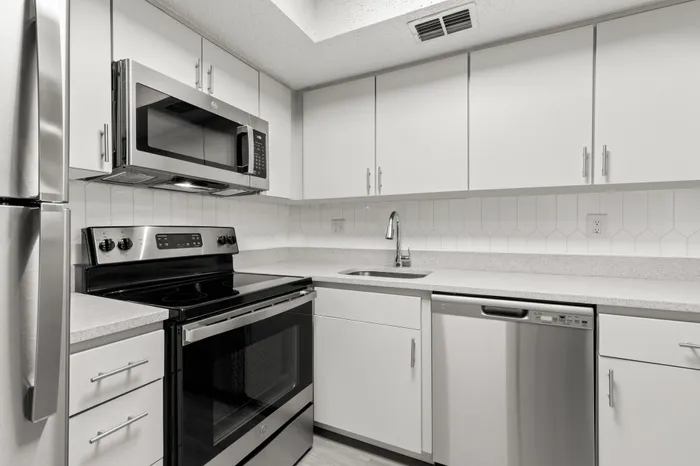 Kitchen with white cabinetry in an apartment in Clearwater, FL.