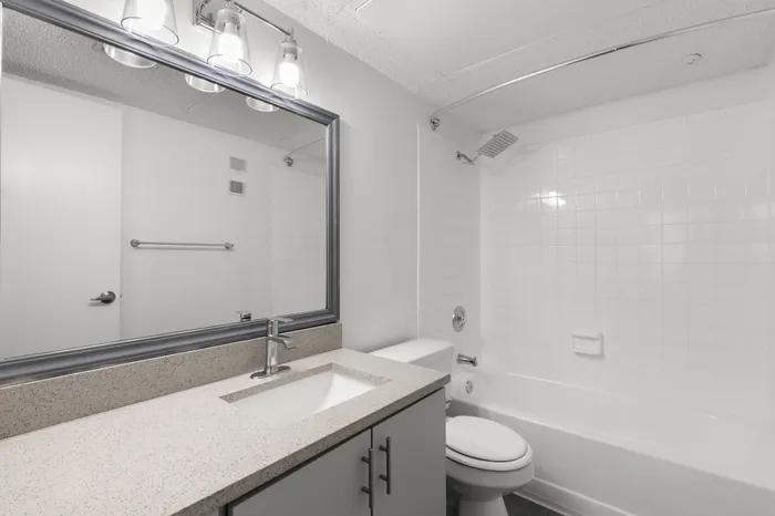 Bathroom with spacious vanity in an apartment on Coachman Rd in Clearwater, FL.