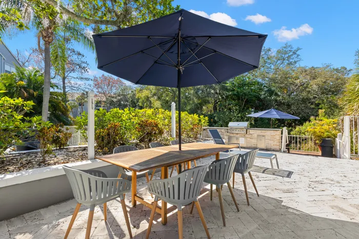 Patio space with seating overlooking pond.