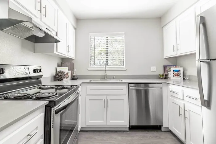 Avana Vista Point newer kitchen with white cabinets and stainless appliances