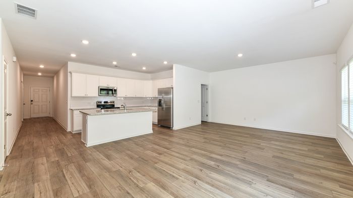 spacious living room and kitchen