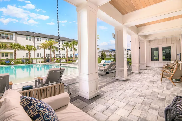 Clubhouse Veranda entrance to pool with soft seating