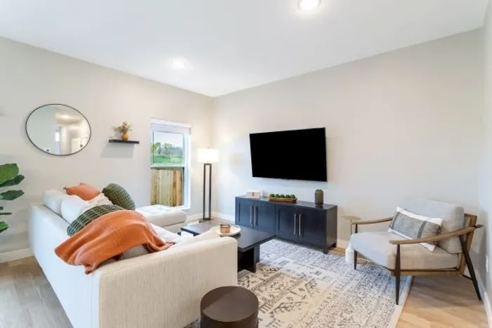 Living room with tv on wall