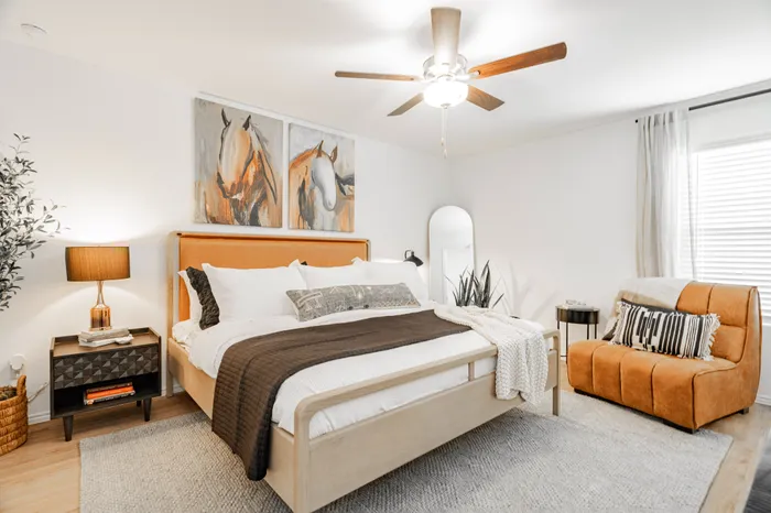 primary bedroom with orange chair