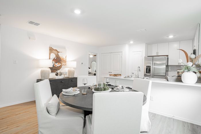 dining room with kitchen in background