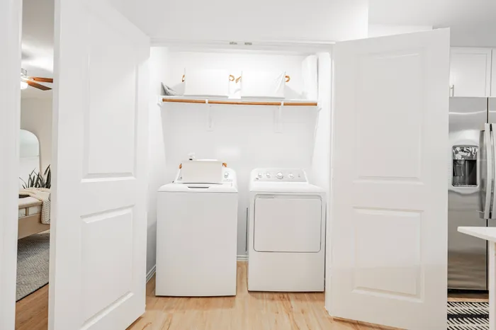 white washer and dryer in closet