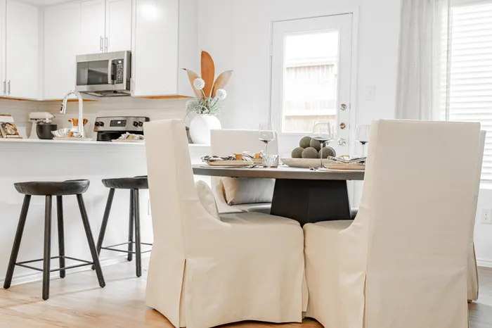 dining room with slip covered chairs