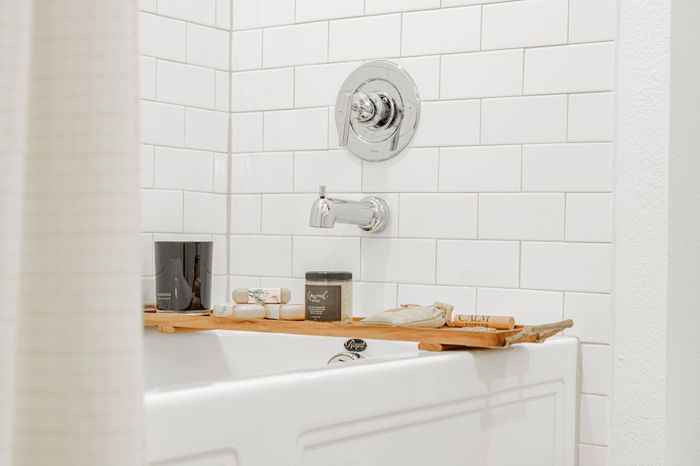 bathtub with white tile