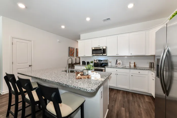 kitchen with granite island with stainless appliances