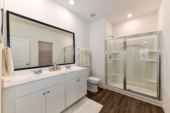 bathroom with white cabinetry
