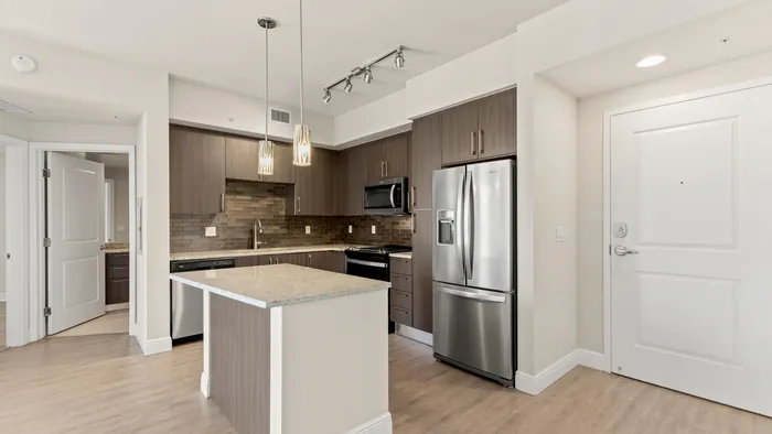 Platinum apartment home kitchen with a chef ready kitchen island