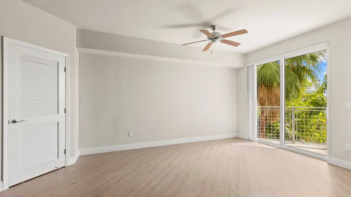 Platinum apartment home with stylish plank flooring with a view of the al fresco balcony