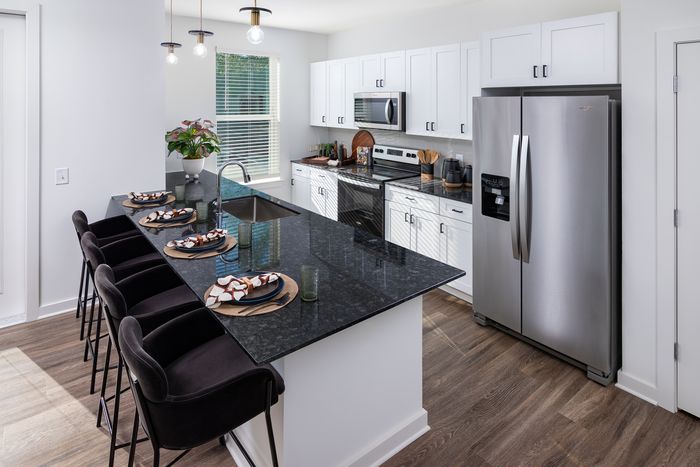 Designer Kitchens with prep islands and pendant lighting