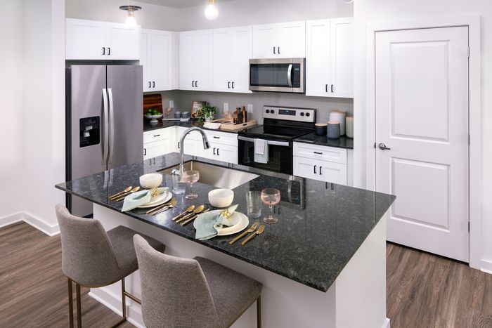 Designer Kitchens with prep islands and pendant lighting
