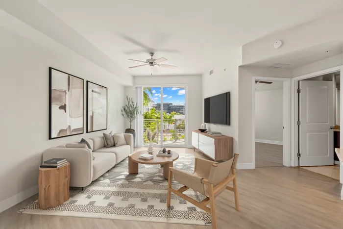 Platinum apartment home with stylish plank flooring with a view of the al fresco balcony