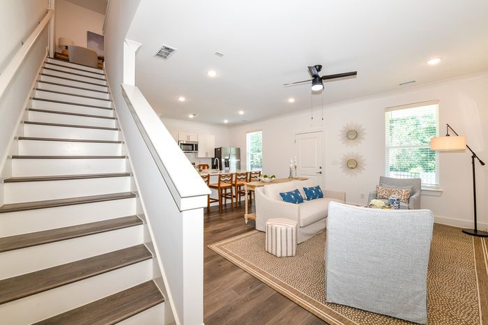 staircase with living room in the background