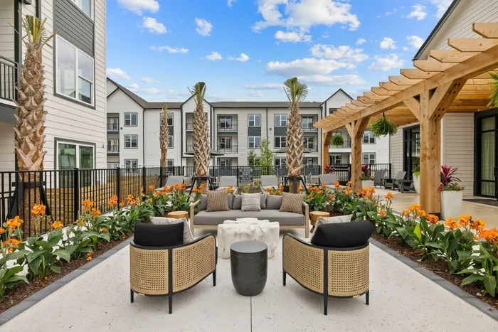 Outdoor seating area with fire pit and landscaping