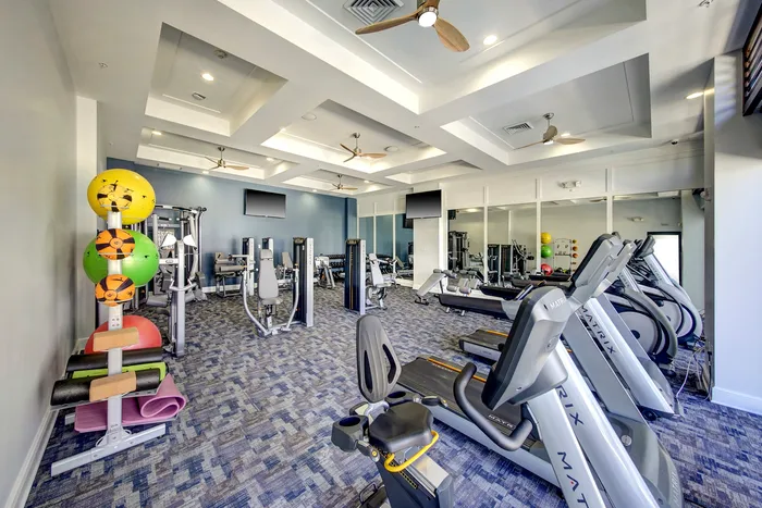 Boca Raton apartment gym with exercise machines and exercise balls.