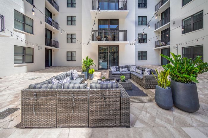 Outdoor patio beside luxury Boca Raton Florida apartments.