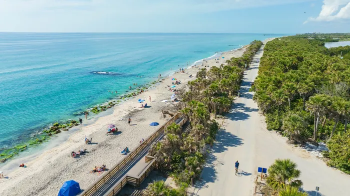 Photo of beach with blue water