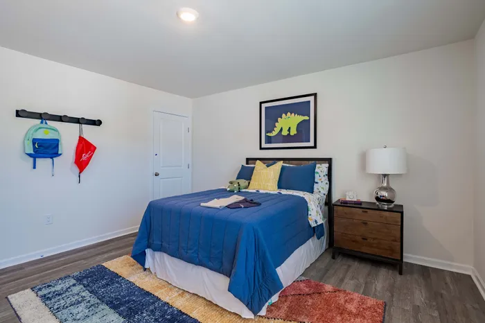 bedroom with bed and blue comforter