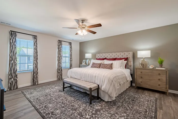 primary bedroom with cream bedspread