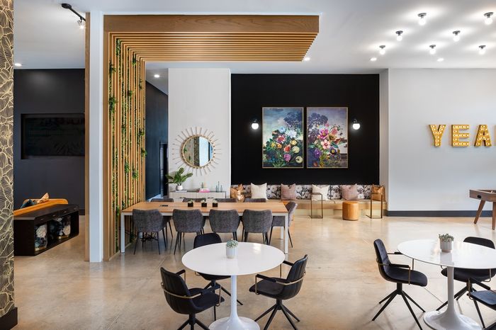 Resident clubroom with ample tables and seating