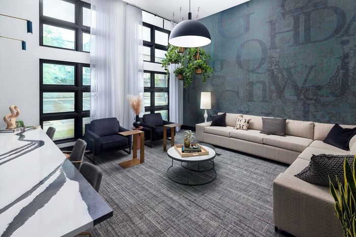 Mini lounge with sectional sofa and workspace table