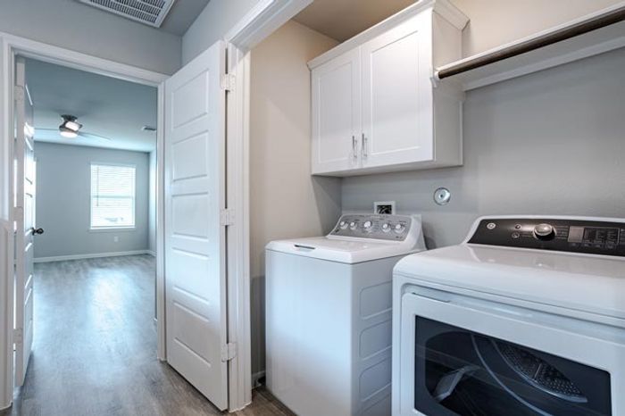laundry room with washer and dryer