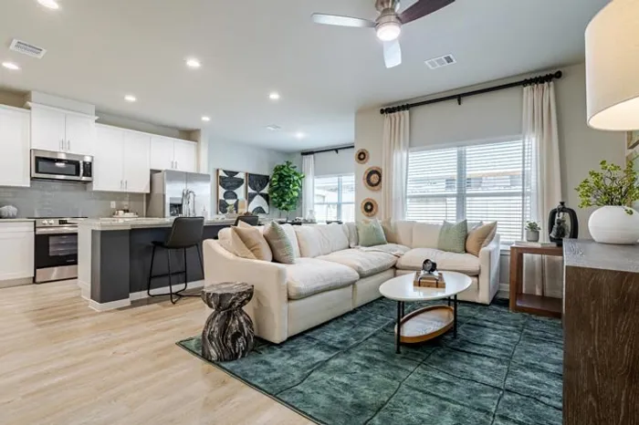 model living room looking into kitchen