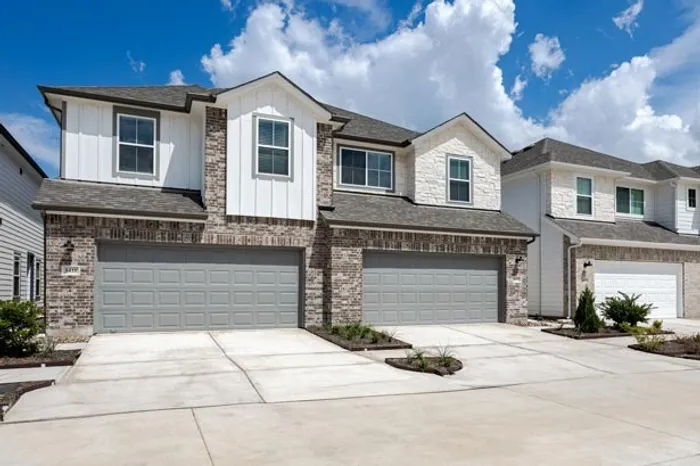 exterior townhome with garage and driveway