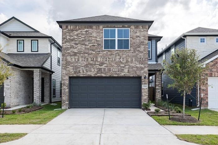 two story single family home with two car garage