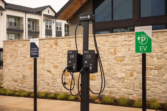 Electric vehicle charging stations at The Prado apartments in Del Valle, TX