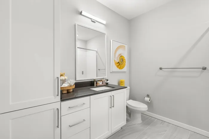 Bathroom vanity with attached linen cabinets