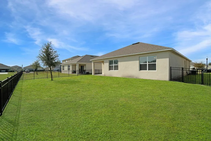 fenced in back yard single family house