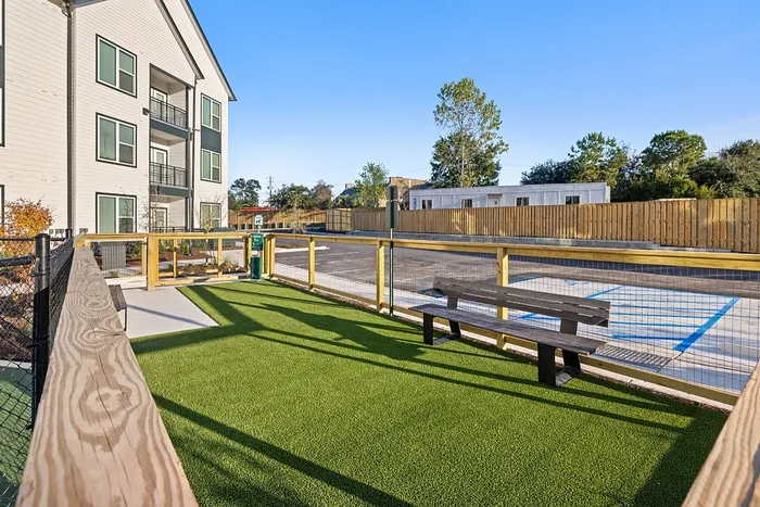 Outdoor recreation area with seating and fenced space