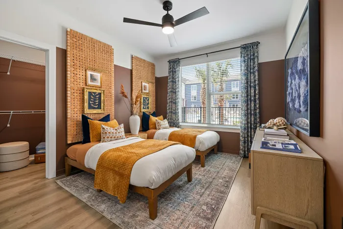 Model residence, large bedroom with twin beds, spacious closet