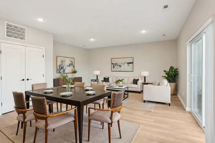 virtually staged dining room and living room with white couches