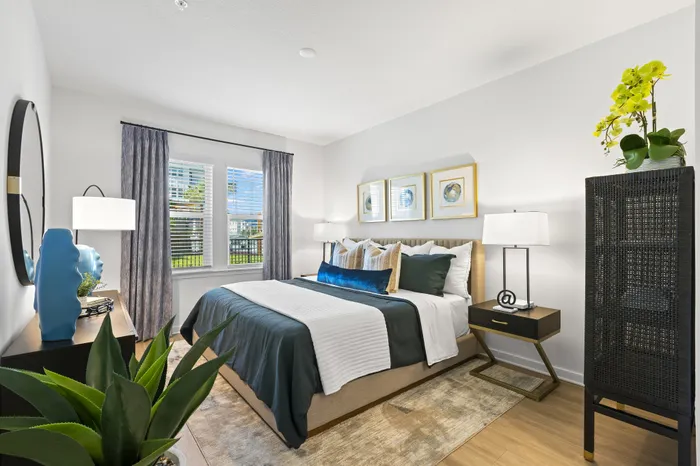 Bedroom with blue and beige bedding