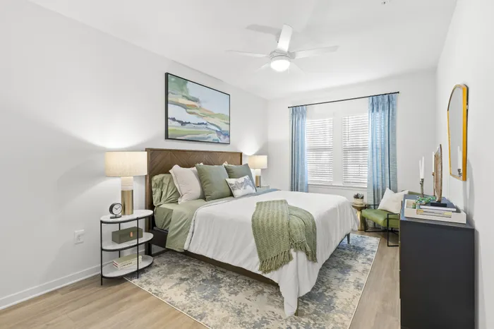 Bedroom with white and green bedding