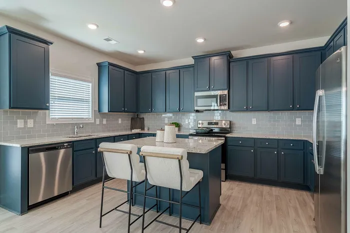 kitchen with navy cabinets