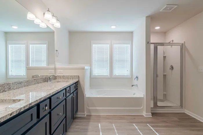 bathroom with shower and tub