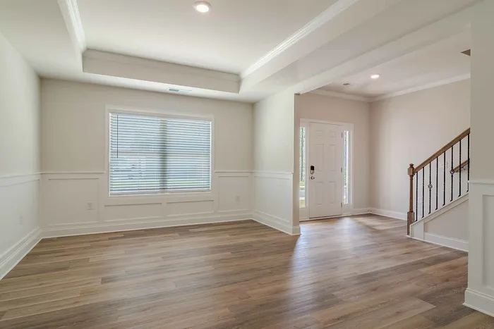 vacant living room with staircase