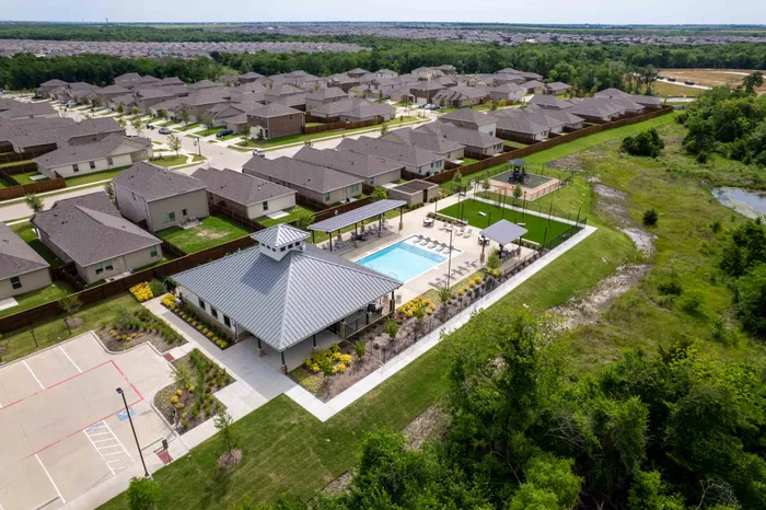 drone photo of clubhouse, pool and community