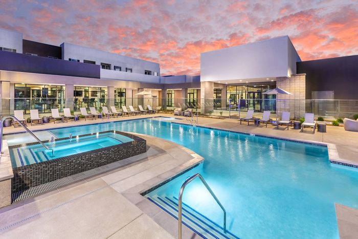 Pool and hot tub at sunset