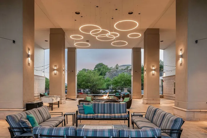 Multiple outdoor lounge areas with secluded seating, year-round gas grilling, fire pit,